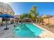 Beautiful backyard featuring a pool, spa, and outdoor seating areas for relaxing at 11866 N 143Rd Ave, Surprise, AZ 85379