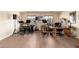 Spacious bonus room featuring a home music studio with wood-look floors and natural light from two windows at 11866 N 143Rd Ave, Surprise, AZ 85379