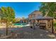Charming gazebo dining area, perfect for outdoor entertaining, with brick pavers at 11866 N 143Rd Ave, Surprise, AZ 85379