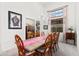 Elegant dining room featuring a decorative window, chandelier, and a dining set at 11866 N 143Rd Ave, Surprise, AZ 85379