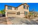 Charming two-story home featuring a desert landscape, covered porch, and well maintained driveway at 11866 N 143Rd Ave, Surprise, AZ 85379
