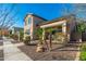 Charming two-story home with a well-maintained front yard and a cozy front porch at 11866 N 143Rd Ave, Surprise, AZ 85379