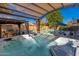 Relaxing backyard hot tub with pool view under a trellis offering a private oasis for unwinding in style at 11866 N 143Rd Ave, Surprise, AZ 85379