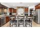 Gourmet kitchen with stainless steel appliances, granite island, and stone accents at 11866 N 143Rd Ave, Surprise, AZ 85379