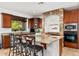 Spacious kitchen with granite countertops, stone accents, and ample cabinet space at 11866 N 143Rd Ave, Surprise, AZ 85379
