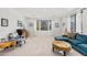 Bright living room features large windows, plush seating, and neutral carpet at 11866 N 143Rd Ave, Surprise, AZ 85379