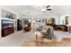 Spacious living room is filled with natural light, neutral walls, and comfortable seating at 11866 N 143Rd Ave, Surprise, AZ 85379