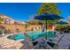 Inviting backyard pool featuring lounge chairs and pristine landscaping in a private setting at 11866 N 143Rd Ave, Surprise, AZ 85379