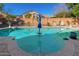 Inviting swimming pool with a central Baja step and landscaped surroundings at 11866 N 143Rd Ave, Surprise, AZ 85379
