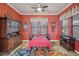 Formal dining room with colorful walls, decorative rug, and traditional wooden furniture at 12017 W Monte Lindo Ln, Sun City, AZ 85373