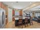 Open kitchen design featuring a large island with seating and stainless steel appliances at 12017 W Monte Lindo Ln, Sun City, AZ 85373