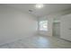 Neutral bedroom featuring closet space, updated tile floors and window overlooking the front yard at 1225 E San Angelo Ave, Gilbert, AZ 85234