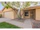 Charming single-story home with mature tree, low maintenance landscaping and two car garage at 1225 E San Angelo Ave, Gilbert, AZ 85234