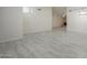Open-concept floor plan with tile floors and a glimpse of a fireplace at 1225 E San Angelo Ave, Gilbert, AZ 85234