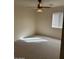 This bedroom features carpet and a modern ceiling fan with light fixture at 12848 W Desert Mirage Dr, Peoria, AZ 85383
