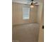 This bedroom features carpet and a modern ceiling fan with light fixture at 12848 W Desert Mirage Dr, Peoria, AZ 85383