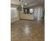 Open dining area with breakfast bar overlooking kitchen and sliding glass doors at 12848 W Desert Mirage Dr, Peoria, AZ 85383