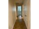 Hallway with tile flooring leading to bedroom with natural light at 12848 W Desert Mirage Dr, Peoria, AZ 85383