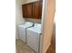 Laundry room with washer and dryer units and tiled flooring at 12848 W Desert Mirage Dr, Peoria, AZ 85383