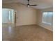 Spacious living room with a ceiling fan and ample natural light at 12848 W Desert Mirage Dr, Peoria, AZ 85383