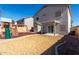 Exterior view of home's backyard featuring a grass yard, and covered patio at 1370 S 228Th Ln, Buckeye, AZ 85326