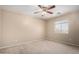 Bedroom featuring neutral walls, ceiling fan, carpet, and a window for natural light at 1370 S 228Th Ln, Buckeye, AZ 85326