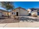 Inviting home showcasing manicured desert landscaping, a driveway, and an attached two-car garage at 1370 S 228Th Ln, Buckeye, AZ 85326