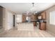 Charming kitchen with wooden cabinets, stainless steel appliances, and a center island for meal preparation at 1370 S 228Th Ln, Buckeye, AZ 85326