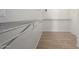 Spacious walk-in closet with wire shelving and wood-look flooring for organized storage at 1370 S 228Th Ln, Buckeye, AZ 85326