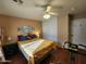 Bright bedroom with a queen bed, wood floors, and ample closet space at 13830 W Fargo Dr, Surprise, AZ 85374