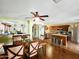 Open concept dining room with hardwood floors and kitchen views at 13830 W Fargo Dr, Surprise, AZ 85374