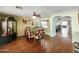Spacious dining area with hardwood floors and adjacent living room at 13830 W Fargo Dr, Surprise, AZ 85374