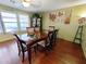 Bright dining room featuring hardwood floors and large windows at 13830 W Fargo Dr, Surprise, AZ 85374