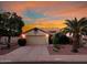 Tan house with tile roof, two-car garage, and desert landscaping at 13830 W Fargo Dr, Surprise, AZ 85374