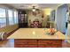 Kitchen island with granite countertop and wood cabinets at 13830 W Fargo Dr, Surprise, AZ 85374