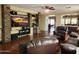 Spacious living room with hardwood floors, fireplace, and home theater at 13830 W Fargo Dr, Surprise, AZ 85374