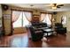Living room with hardwood floors, and large windows at 13830 W Fargo Dr, Surprise, AZ 85374