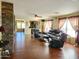 Living area with hardwood floors, and views to dining area at 13830 W Fargo Dr, Surprise, AZ 85374