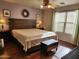 Large main bedroom with wood floors and neutral color palette at 13830 W Fargo Dr, Surprise, AZ 85374