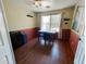 Home office with wood floors, built-in shelving, and a work table at 13830 W Fargo Dr, Surprise, AZ 85374