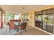 Covered patio with hot tub, seating area, and access to backyard at 13830 W Fargo Dr, Surprise, AZ 85374