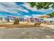 Modern playground with colorful play structures and benches at 13830 W Fargo Dr, Surprise, AZ 85374