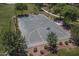 Aerial view of a well-maintained community basketball court surrounded by greenery at 1437 W Smoke Tree Ave, San Tan Valley, AZ 85140