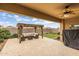Covered patio with outdoor seating area with pergola and ceiling fan at 1437 W Smoke Tree Ave, San Tan Valley, AZ 85140