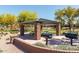 Well-maintained picnic area featuring shaded seating and BBQ grills at 1437 W Smoke Tree Ave, San Tan Valley, AZ 85140