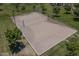Aerial view of a well-maintained sand volleyball court in a grassy area at 1437 W Smoke Tree Ave, San Tan Valley, AZ 85140