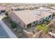 Aerial view of home with landscaped backyard featuring covered patio and built-in BBQ at 1808 E Crocus Ave, Queen Creek, AZ 85140