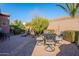 Green backyard featuring lush greenery, and a cozy seating area at 1808 E Crocus Ave, Queen Creek, AZ 85140