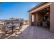 Inviting backyard featuring a built-in BBQ, brick patio, and covered area with fireplace at 1808 E Crocus Ave, Queen Creek, AZ 85140
