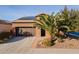 Beautiful single Gathering home with a well maintained lawn, mature trees, and solar panels on the roof at 1808 E Crocus Ave, Queen Creek, AZ 85140